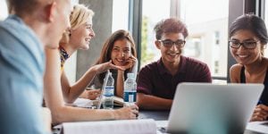 Photo of higher ed students studying with laptops 
